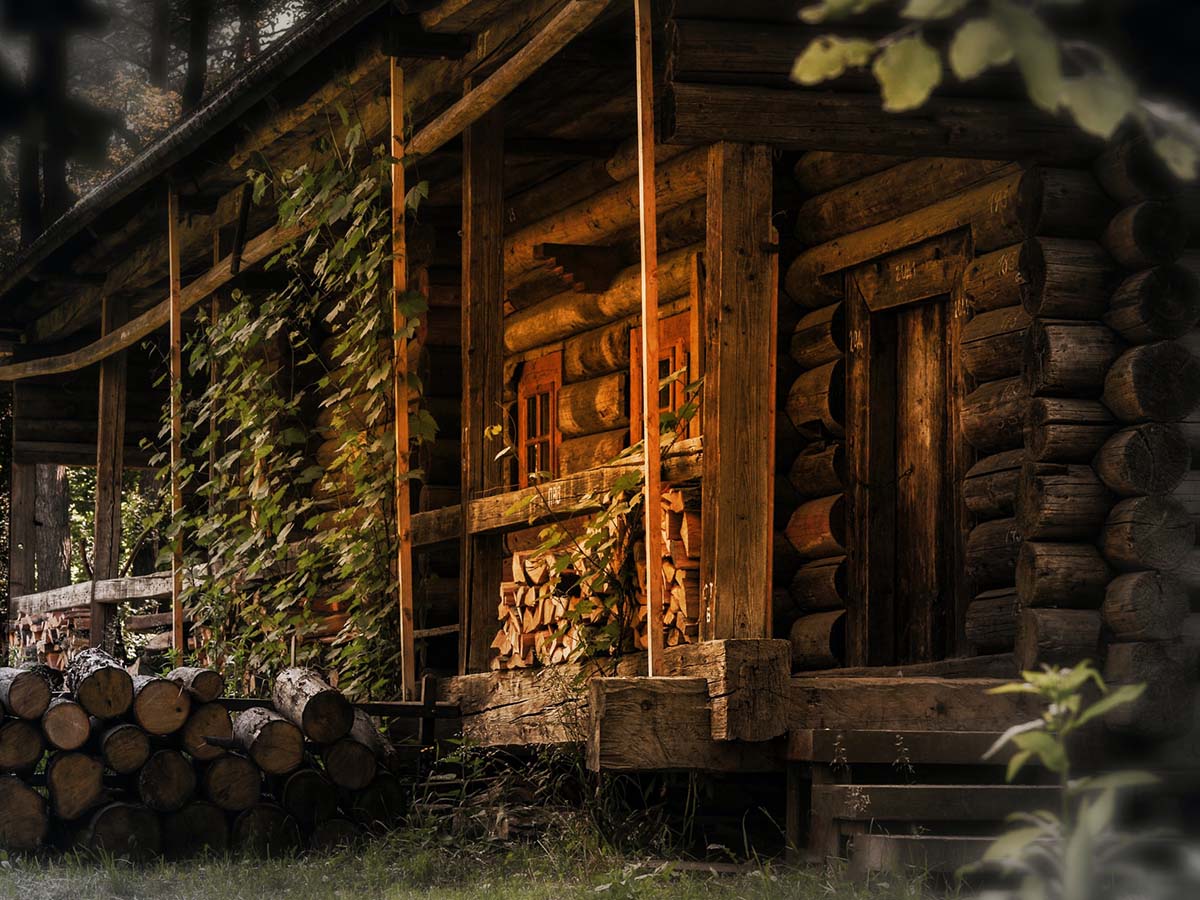 Sunlight shining on the porch of a log cabin