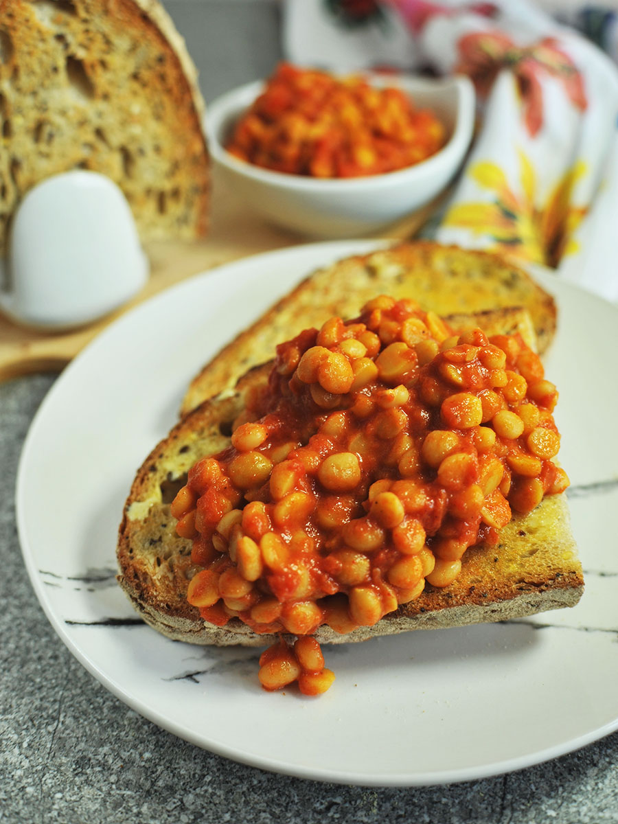 Close up of hot buttered toast dripping with faked beans.