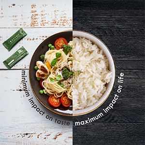 Clickable link showing a plate of food, seperated down the centre with plain white rice on the right and a balanced, appetising meal on the left besides a sachet of fodzyme. Text reads minimum impact on taste, maximum impact on life.